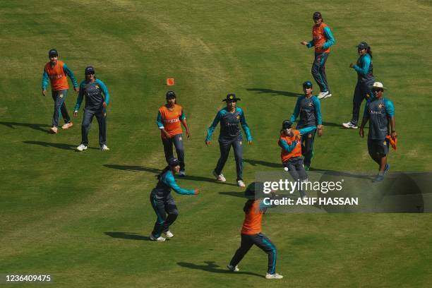 Pakistan's players take part in a practice session at a stadium in Karachi on November 7 ahead of the three Women's One Day Internationals against...