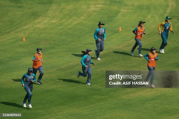 Pakistan's players take part in a practise session at a stadium in Karachi on November 7 ahead of the three Women's One Day Internationals against...