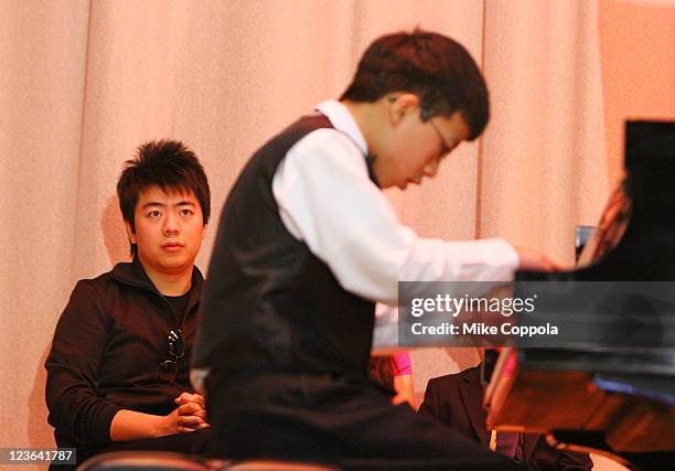 Pianist Lang Lang and US Young Scholar Derek Wang perform at PS 334 - The Anderson School on January 3, 2011 in New York City.