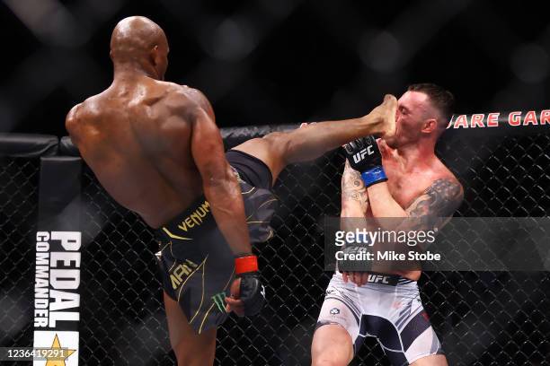 Kamaru Usman celebrates kicks Colby Covington in their welterweight title bout during the UFC 268 event at Madison Square Garden on November 06, 2021...
