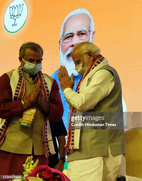 Prime Minister Narendra Modi with Delhi Pradesh BJP President Adesh Gupta during BJP National Executive Meeting at NDMC Convention Centre on November...