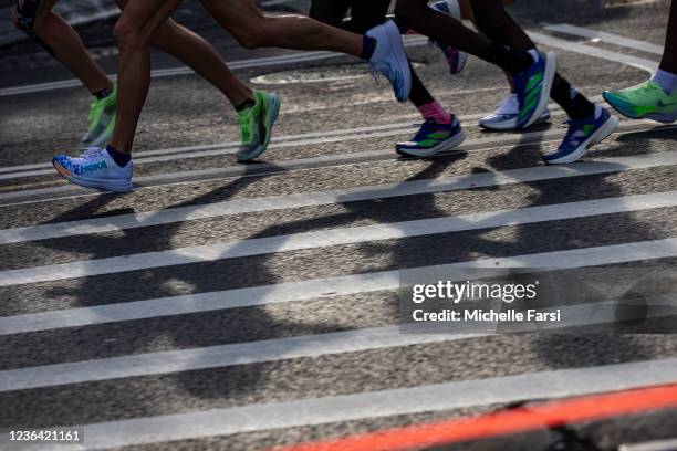 The lead pack of the women's race runs through Brooklyn during the 2021 TCS New York City Marathon on November 07, 2021 in New York City.