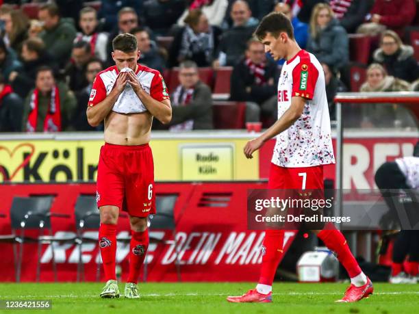 Salih Oezcan of FC Koeln and Dejan Ljubicic of FC Koeln looks dejected during the Bundesliga match between 1. FC Köln and 1. FC Union Berlin at...