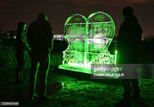 One ton heart-shaped ice sculpture created by artist, Envy is unveiled at the Govan Dry Dock on the Clyde, near the Scottish Event Campus in Glasgow,...