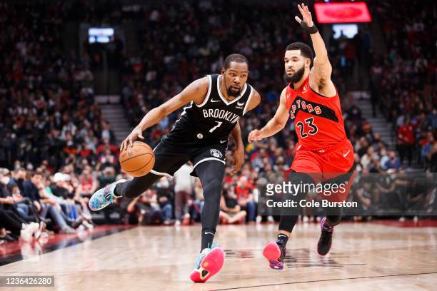 Kevin Durant of the Brooklyn Nets drives on Fred VanVleet of the Toronto Raptors during the first half of their NBA game at Scotiabank Arena on...