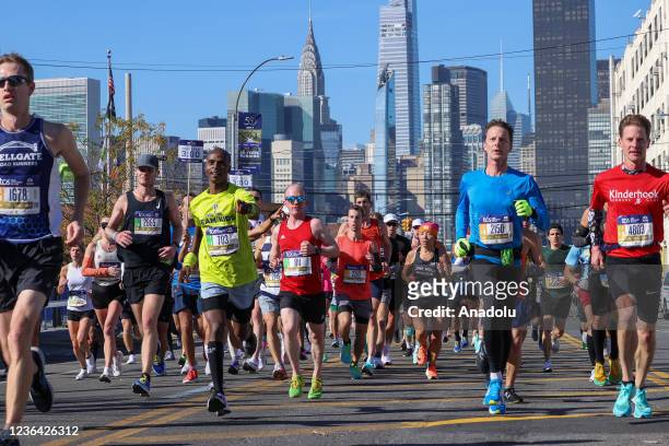 Participants run during the TCS New York City Marathon in New York City, United States on November 07, 2021.