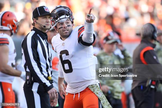 Cleveland Browns quarterback Baker Mayfield points to the scoreboard while talking to a referee during the game against the Cleveland Browns and the...