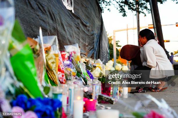 Visitors look at the memorial outside of the canceled Astroworld festival at NRG Park on November 7, 2021 in Houston, Texas. According to...