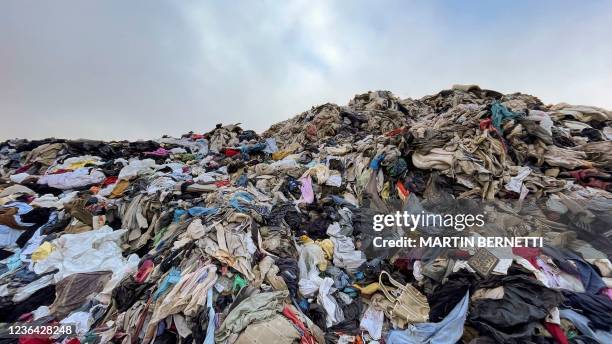 View of used clothes discarded in the Atacama desert, in Alto Hospicio, Iquique, Chile, on September 26, 2021. EcoFibra, Ecocitex and Sembra are...