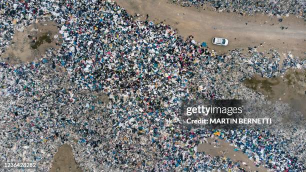 Aerial view of used clothes discarded in the Atacama desert, in Alto Hospicio, Iquique, Chile, on September 26, 2021. EcoFibra, Ecocitex and Sembra...