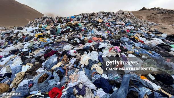 View of used clothes discarded in the Atacama desert, in Alto Hospicio, Iquique, Chile, on September 26, 2021. EcoFibra, Ecocitex and Sembra are...