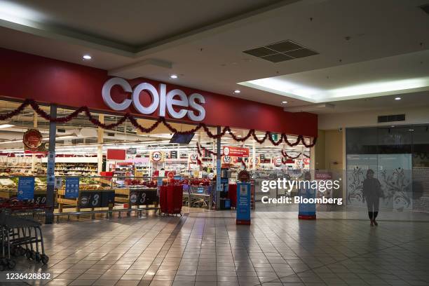 Customer leaves a Coles Group Ltd. Supermarket in Melbourne, Australia, on Sunday, Nov. 7, 2021. Australian retailers suffered their worst quarter of...