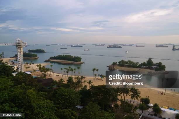 Container ships and bulk carriers offshore from Sentosa Island in Singapore, on Sunday, Nov. 7, 2021. The world's largest shipping hubs are suffering...
