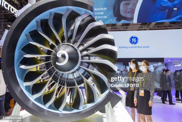 Visitors look at a LEAP aero-engine model at GE General Electric during the 4th China International Import Expo in Shanghai, China, Nov 6, 2021.