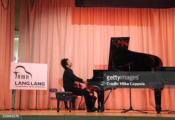 Pianist Lang Lang performs at PS 334 - The Anderson School during his visit on behalf of the VH1 Save The Music Foundation: Lang Lang International...