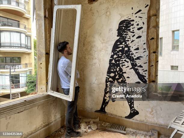 Group of street artists from various countries draw paintings on the walls of the damaged buildings in the Beirut Port blast and abandoned buildings...