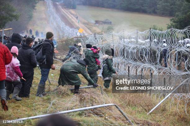 Picture taken on November 8, 2021 shows migrants at the Belarusian-Polish border in the Grodno region. - Poland on November 8 said hundreds of...