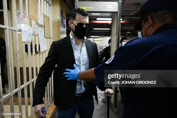 Ricardo Martinelli Jr, son of Panamanian former president Ricardo Martinelli, is frisked upon arriving for a hearing related to an extradition...