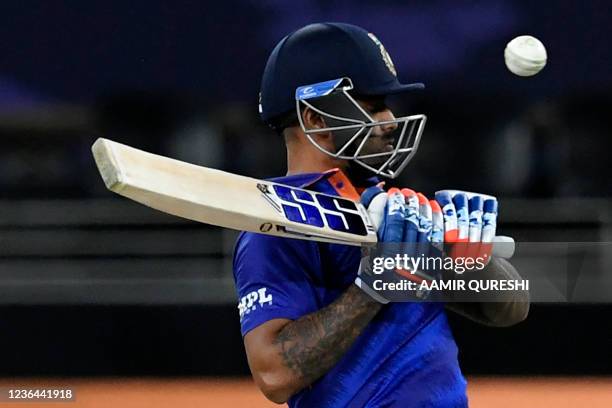 India's Suryakumar Yadav avoids a bouncer during the ICC mens Twenty20 World Cup cricket match between India and Namibia at the Dubai International...