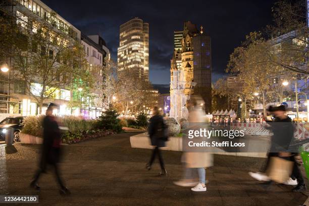 People walk in front of the Kaiser Wilhelm Memorial Church on November 8, 2021 in Berlin, Germany. Infections rates for the novel coronavirus have...