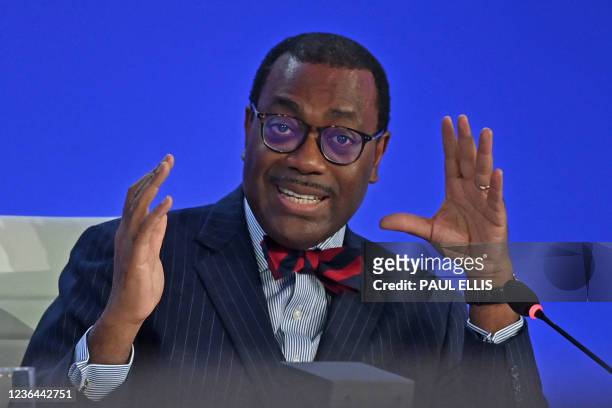President of the African Development Bank, Akinwumi Adesina gestures as he speaks during the Improving the Scale and Effectiveness of Adaptation...