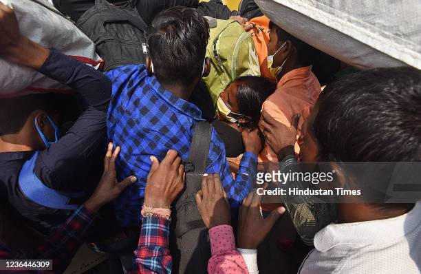 Crowd of passengers struggling to get on Bihar Bhagalpur Train during the heavy rush for Chhath Puja festival at Anand Vihar Railway Station on...
