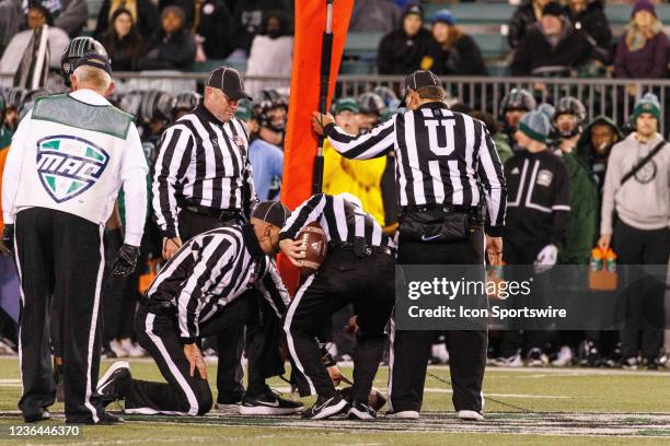 Mid-American Conference officials measure for a first down during a Mid-American Conference game between the Miami RedHawks and Ohio University...