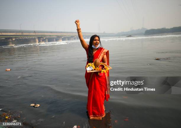 Supporter shout slogans against AAP ruled Delhi government for not allowing to perform Chhath Puja on the banks of Yamuna river at ITO on November 8,...