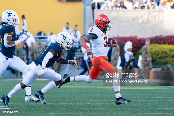 Oklahoma State Cowboys Quarterback Spencer Sanders runs with the ball during the first half of the College Football game between the Oklahoma State...
