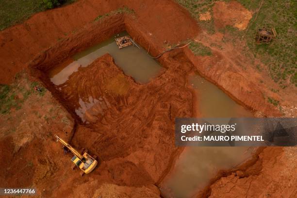 Aerial view of an illegal gold mine in Sao Felix do Xingu, Para state, Brazil, on September 21, 2021. - Illegal mining never went away in Brazil, but...