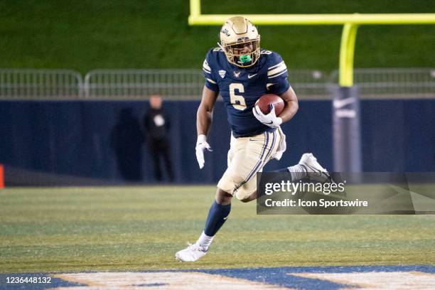 Akron Zips Running Back Jonzell Norrils runs with the ball during the first half of the College Football game between the Ball State Cardinals and...