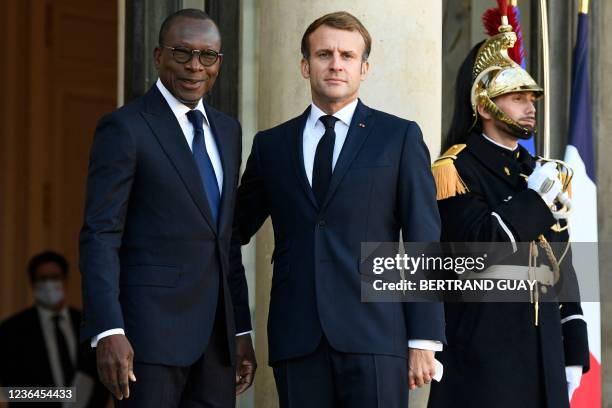 French President Emmanuel Macron welcomes Benin's President Patrice Talon at the Elysee Palace in Paris, on November 9, 2021. - France solemnly...