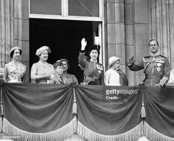Queen Elizabeth II waves to the audience from the balcony of Buckingham Palace for her birthday, on April 21, 1956 in London, with Prince Philip, duc...