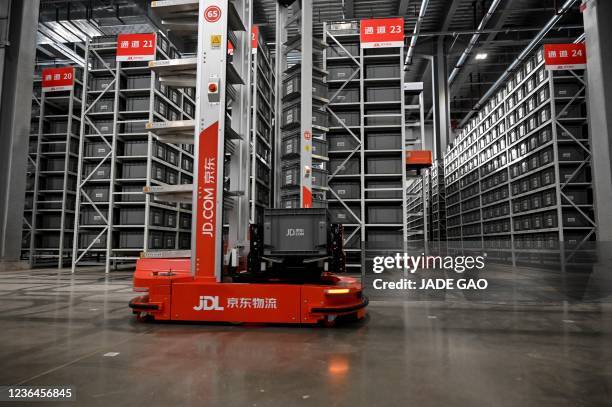 Automated guided vehicles move to pick up boxes with packages for delivery ahead of the Singles Day shopping festival which falls on November 11, at...