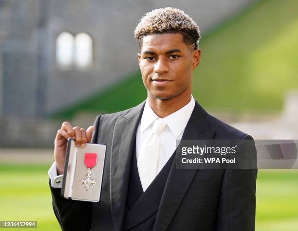 Footballer Marcus Rashford after receiving his MBE for services to Vulnerable Children in the UK during Covid-19 during an investiture ceremony at...