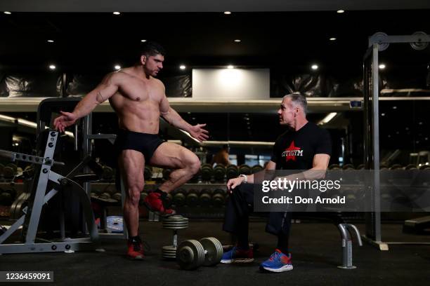 Chris Kavvalos is seen in discussion with Paul Haslam during a workout at City Gym on May 24, 2020 in Sydney, Australia. IFBB body builder Chris...