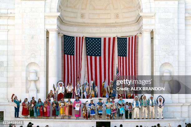 Members of the Crow Nation perform in the Memorial Amphitheater during a centennial commemoration event at the Tomb of the Unknown Soldier, in...