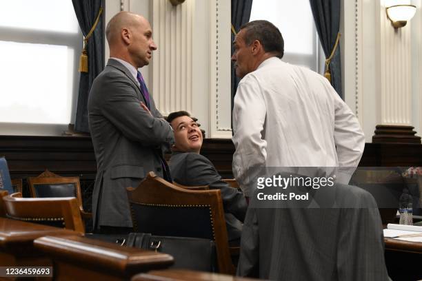 Kyle Rittenhouse and his defense attorneys Corey Chirafisi left and Mark Richards before begins during the Kyle Rittenhouse trial on November 9, 2021...