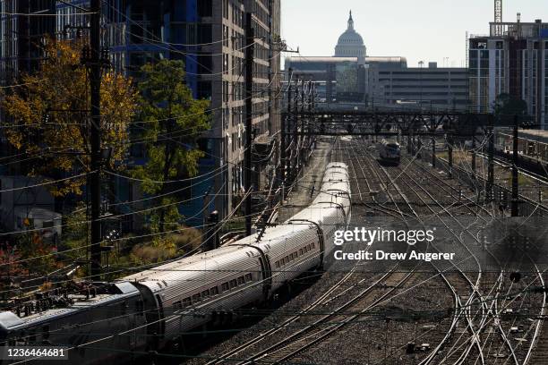 An Amtrak Northeast Regional train leaves Union Station on November 9, 2021 in Washington, DC. The $1 trillion infrastructure bill recently passed in...