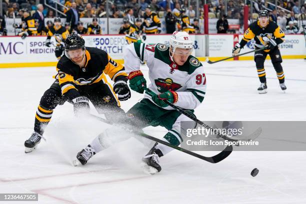 Minnesota Wild Left Wing Kirill Kaprizov skates with the puck as Pittsburgh Penguins Defenseman Mike Matheson defends during the third period in the...