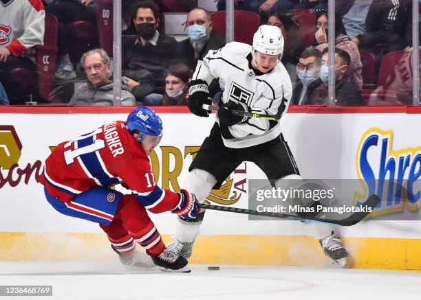 Brendan Gallagher of the Montreal Canadiens and Olli Maatta of the Los Angeles Kings skate for the puck during the third period at Centre Bell on...