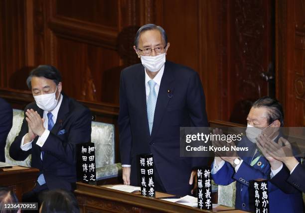 Hiroyuki Hosoda of Japan's ruling Liberal Democratic Party stands after being elected as the House of Representatives' speaker during a plenary...