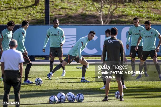 Portugal's forward Cristiano Ronaldo and teammates attend a training session at the Cidade do Futebol training ground in Oeiras on November 10 ahead...