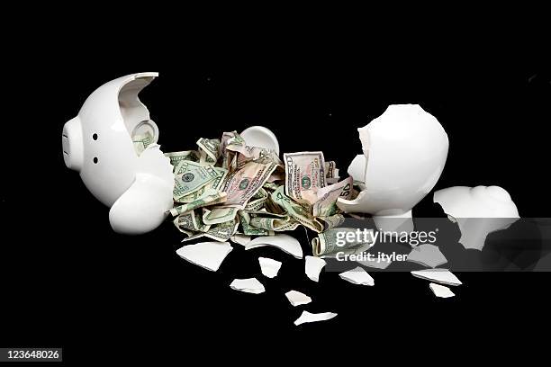 broken piggy bank with crumpled bills - smashed piggy bank stock pictures, royalty-free photos & images