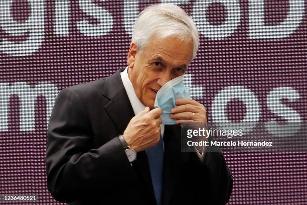 President of Chile Sebastian Piñera looks on during a prior a press conference to promulgate the law for the National Registry of Food Pension...