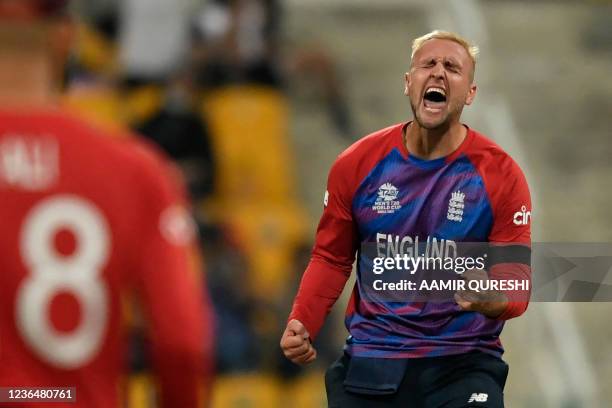 England's Liam Livingstone celebrates after taking the wicket of New Zealand's Glenn Phillips during the ICC mens Twenty20 World Cup semi-final match...