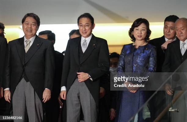 Japanese Prime Minister Fumio Kishida leads newly appointed Foreign Minister Yoshimasa Hayashi , Seiko Noda , Minister for Regional Revitalization,...