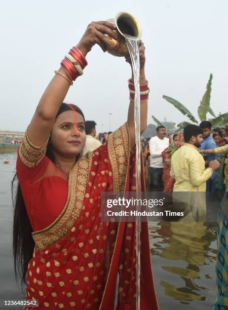 Woman performs rituals on the occasion of Chhath Puja, at Laxman Mela ghat, on November 10, 2021 in Lucknow, India. The festival is unique to the...