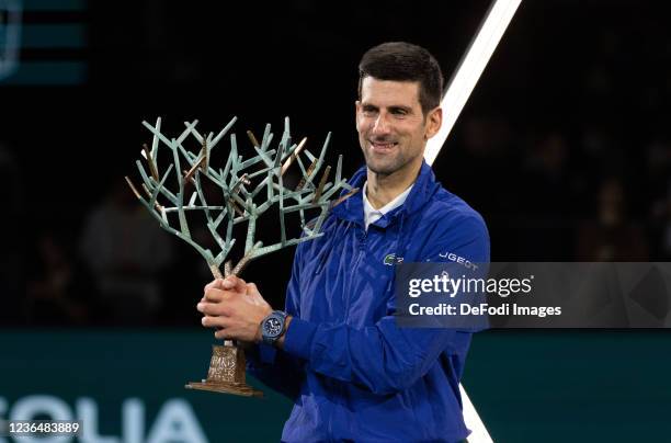 Novak Djokovic of Serbia poses with the trophy after winning the mens singles final against Daniil Medvedev of Russia on day seven of the Rolex Paris...