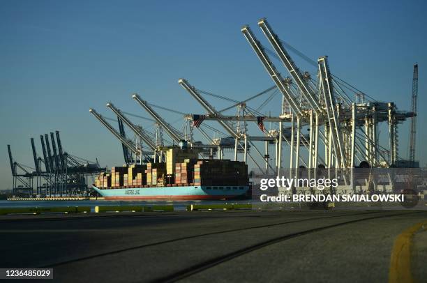 Cranes stack cargo containers at the Port of Baltimore in Baltimore, Maryland, on November 10, 2021. US President Joe Biden on Wednesday is visiting...